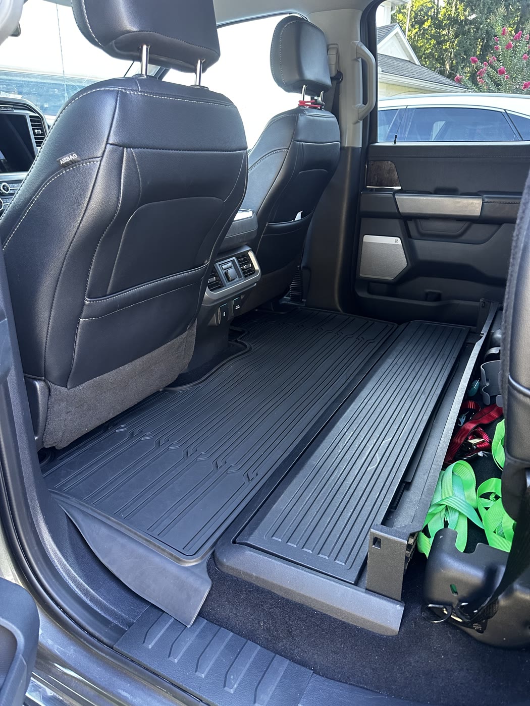 Cleaned black leather rear seats and floor mats