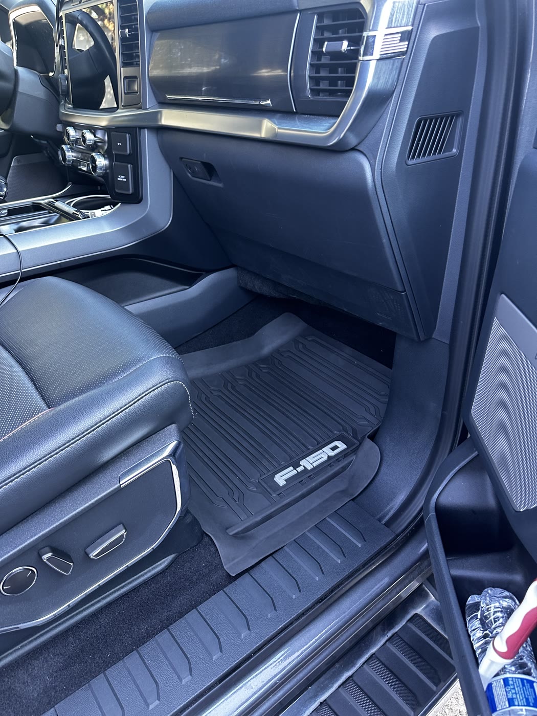 Detailed Ford F-150 interior with clean floor mats